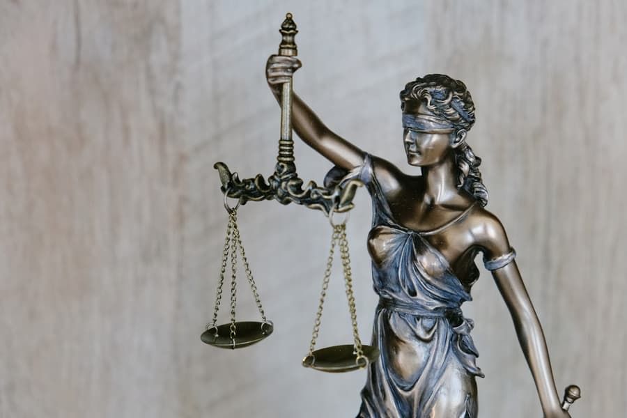 Bronze statue of Lady Justice holding scales